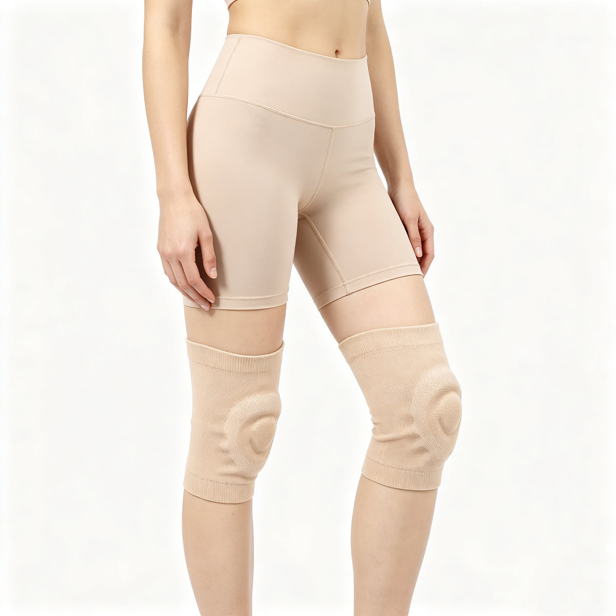 Side view of beige silicone padded knee sleeves worn on both knees

