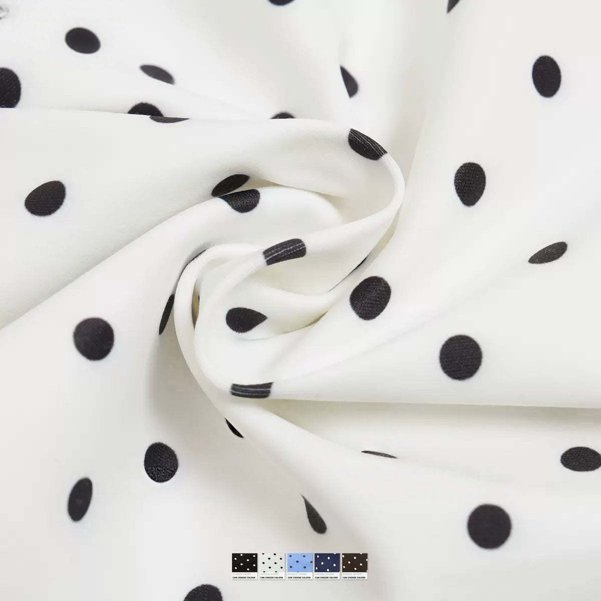 Close-up of white polka dot halter sports bra fabric and strap


