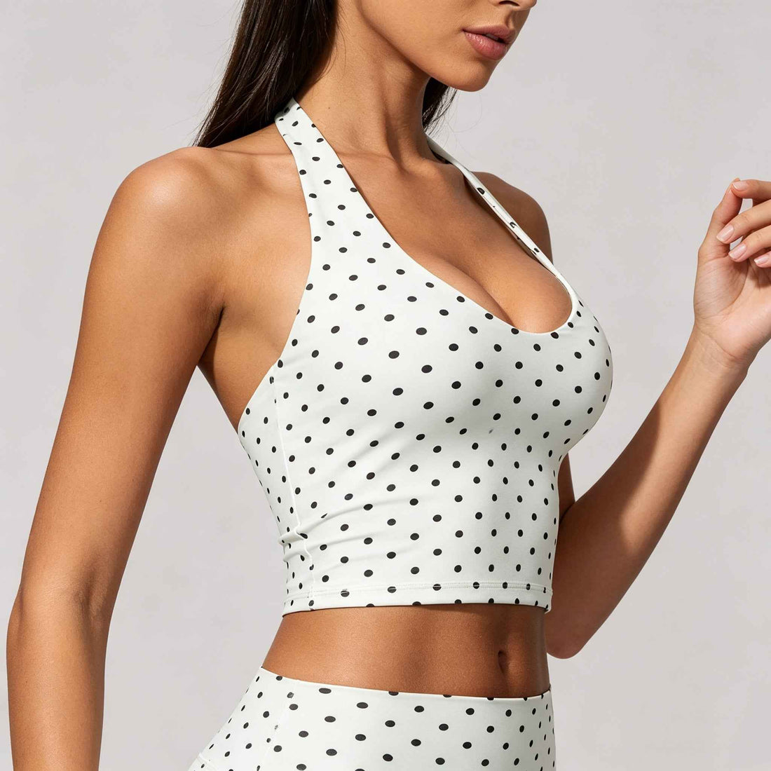 Black polka dot halter sports bra front view

