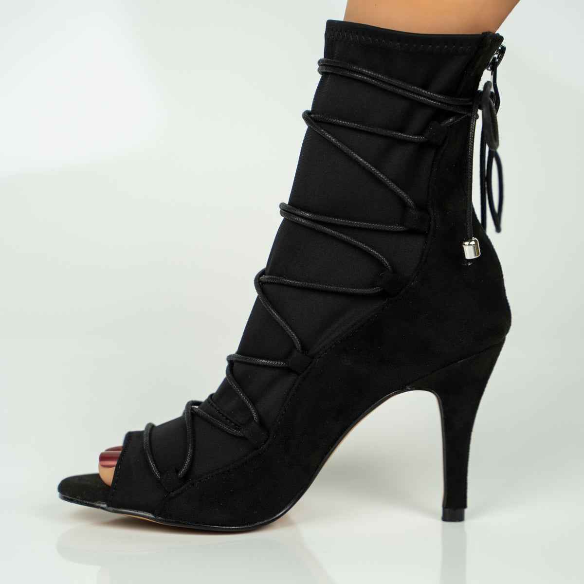 Black high-heeled boot with lace-up design on a white background