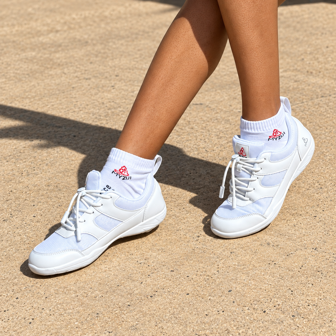 A pair of white athletic sneakers with white mesh panels and white laces, photographed on a seamless white background. The brand logo 'TOD' is visible on the tongue, and a small silver logo is on the heel.